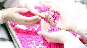 stock-footage-technicians-inspecting-the-quality-of-pills-at-a-pharmaceutical-plant
